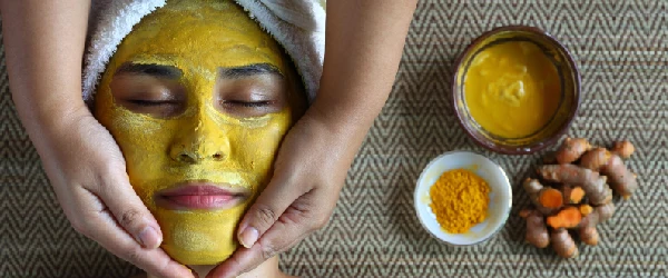 Iahas-relaxing-woman-with-turmeric-facemask-for-good-skin-image